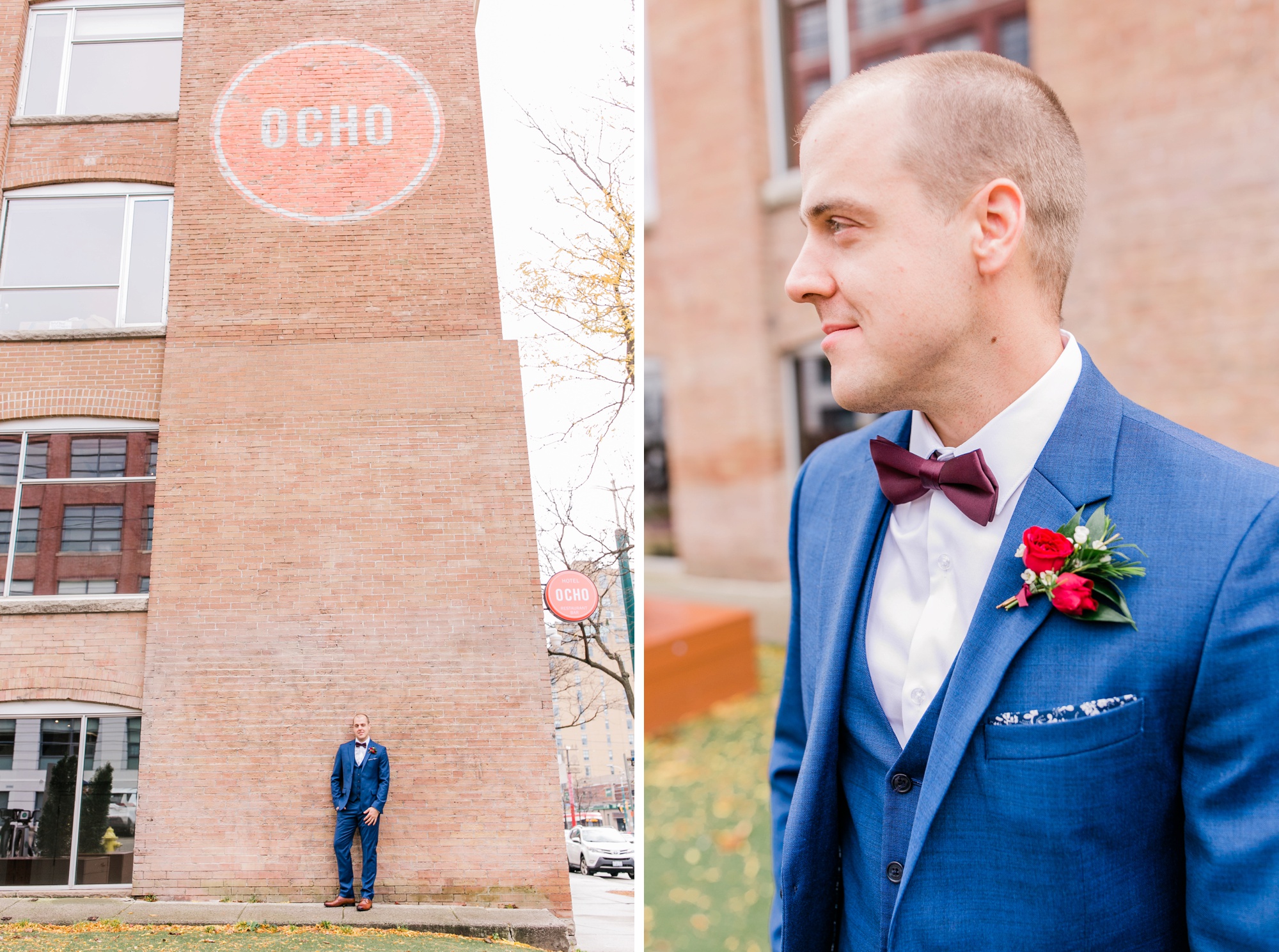 groom with brick wall in navy suit