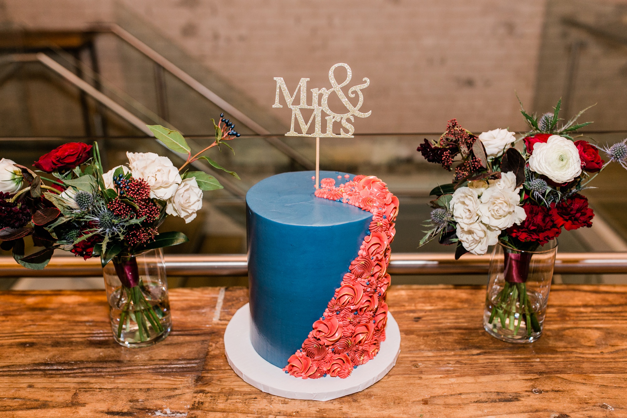 wedding cake with "Mr" and "Mrs" topper